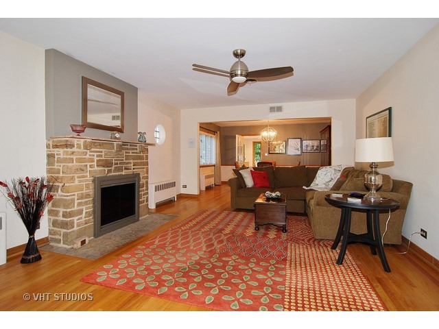 732 Selborne Road Riverside, IL 60546 - Photo 4 of 23 a living room with furniture and a fireplace