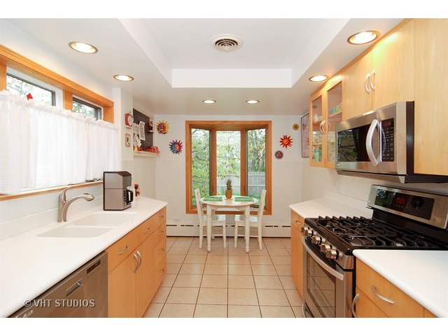 732 Selborne Road Riverside, IL 60546 - Photo 8 of 23 a open kitchen with stainless steel appliances granite countertop a sink stove and cabinets
