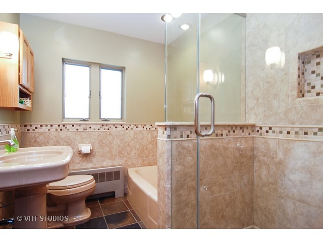 732 Selborne Road Riverside, IL 60546 - Photo 10 of 23 a bathroom with a toilet a sink and mirror