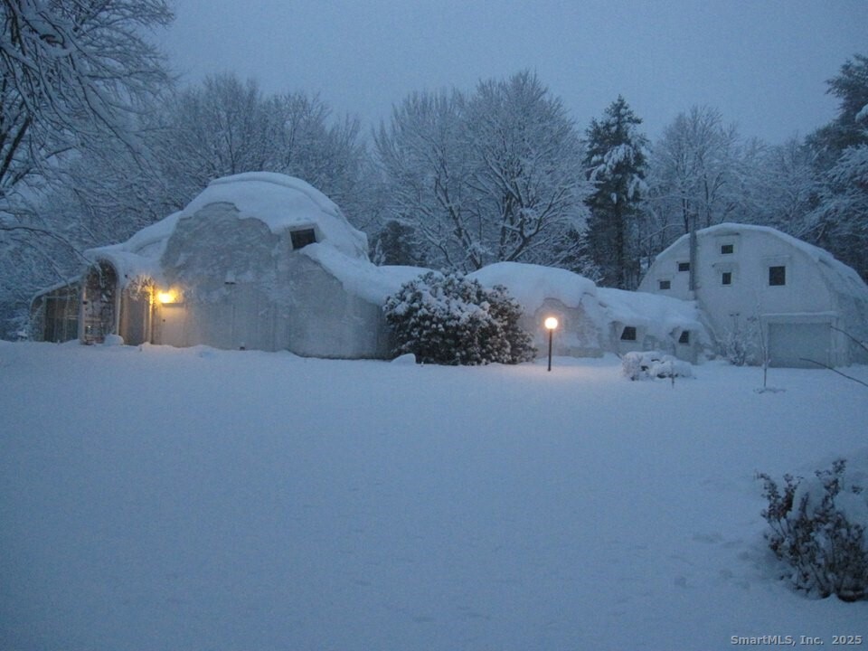a side view of a house with a yard