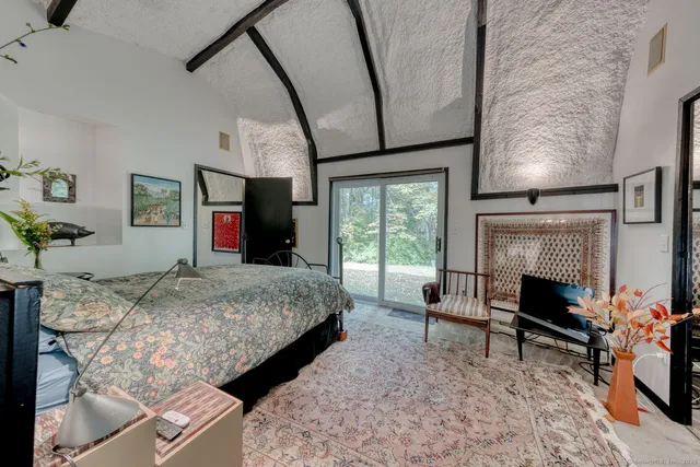 a living room with furniture fireplace and rug