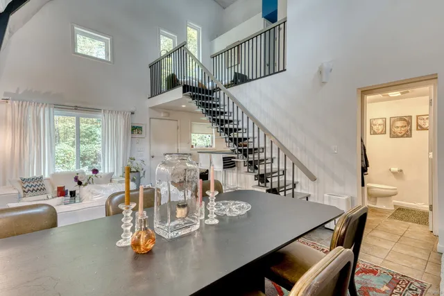 a kitchen with a stove top oven and cabinets