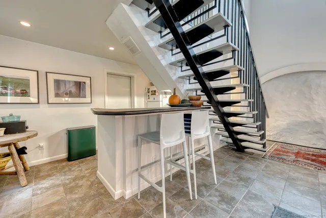 a bedroom with a bed and a mirror