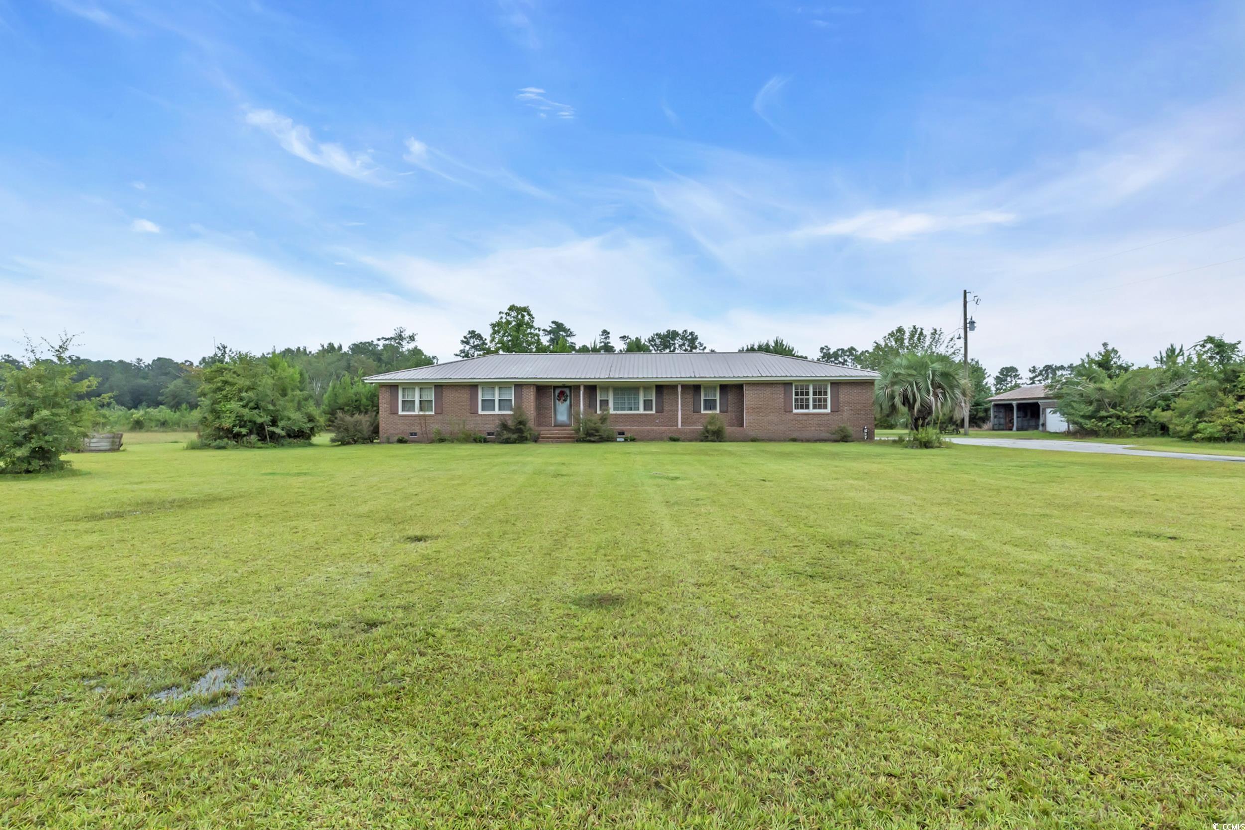 1928 Emery Road Loris, SC 29569 - Photo 2 of 24 Ranch-style house featuring a front lawn and brick siding