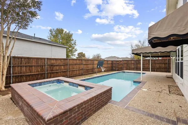 a view of a backyard with sitting area