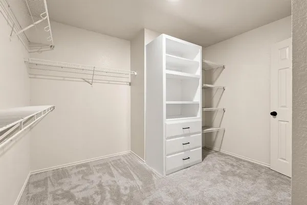 a view of an empty walk in closet