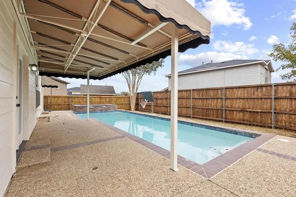a view of a house with swimming pool