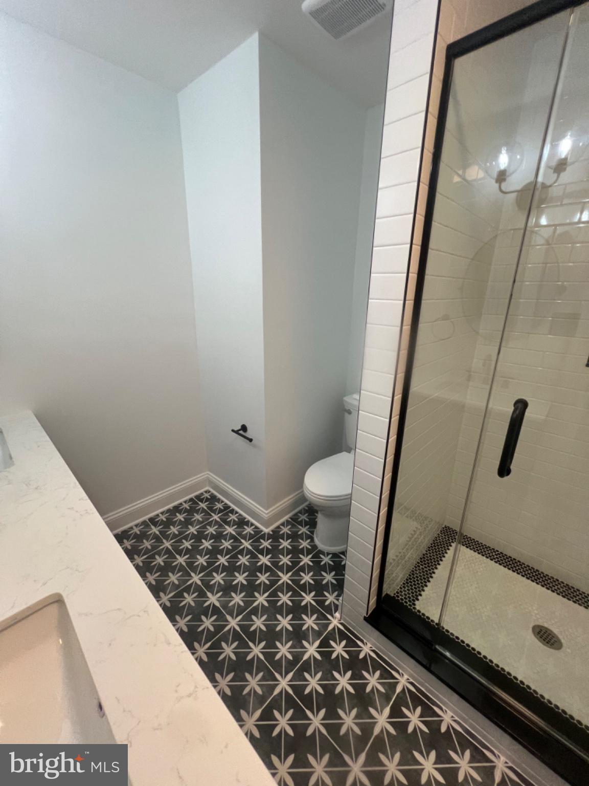 4400 Rendale Court Olney, MD 20832 - Photo 14 of 47 Stylish bathroom with modern tiles.