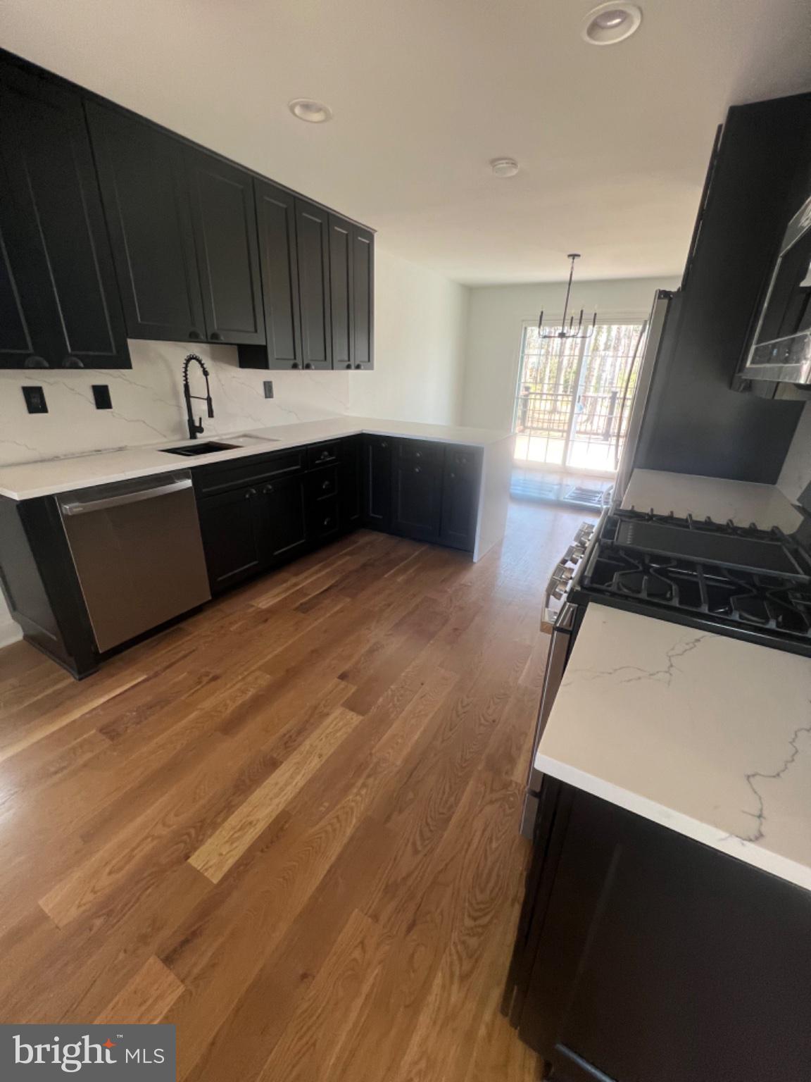 4400 Rendale Court Olney, MD 20832 - Photo 2 of 47 Sleek modern kitchen with natural light.