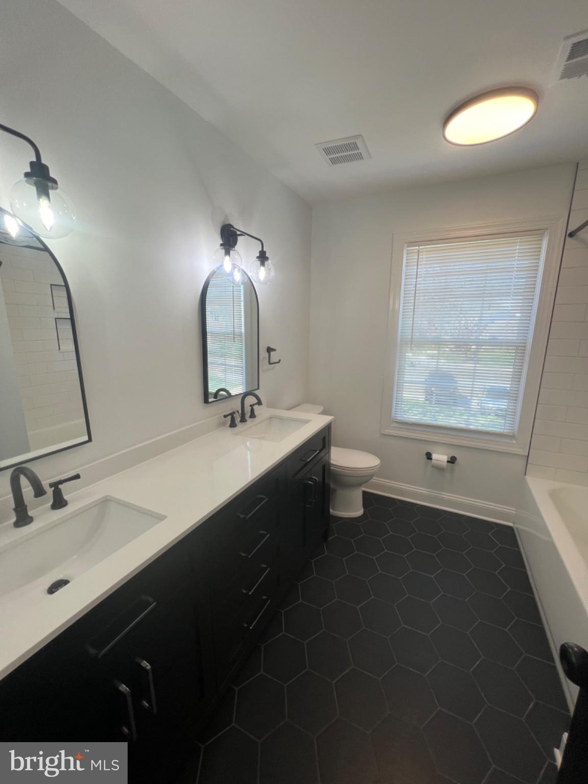 4400 Rendale Court Olney, MD 20832 - Photo 27 of 47 Sleek modern bathroom with elegance.