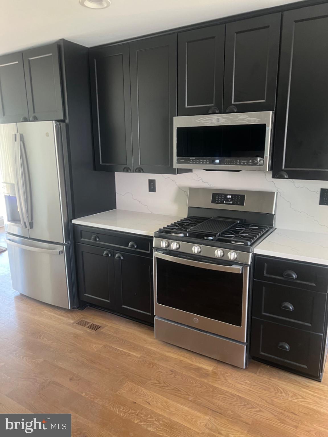 4400 Rendale Court Olney, MD 20832 - Photo 4 of 47 Sleek modern kitchen with elegance.