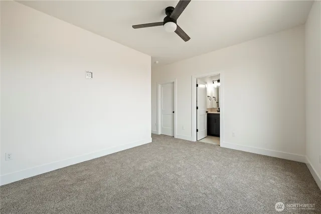 a bathroom with a sink a toilet a mirror and shower