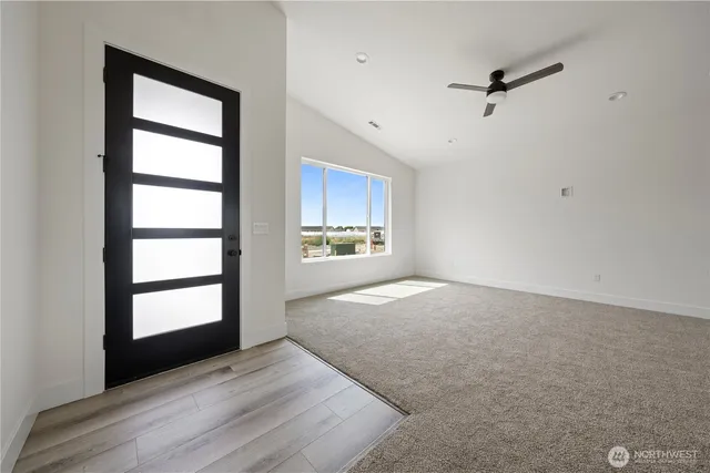 a kitchen with stainless steel appliances kitchen island sink refrigerator and cabinets