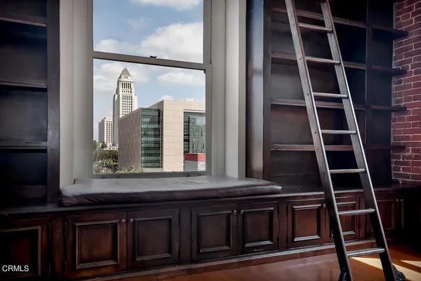 a kitchen with a sink a window and stainless steel appliances