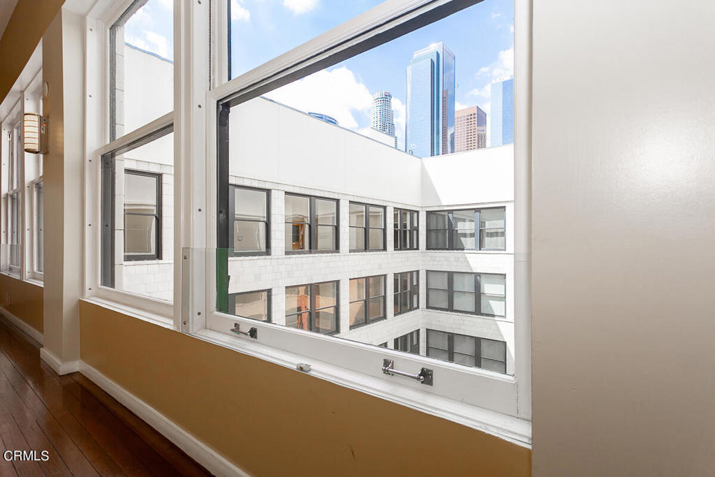 257 South Spring Street, Unit PHE Los Angeles, CA 90012 - Photo 22 of 29 a view of an empty room with a window