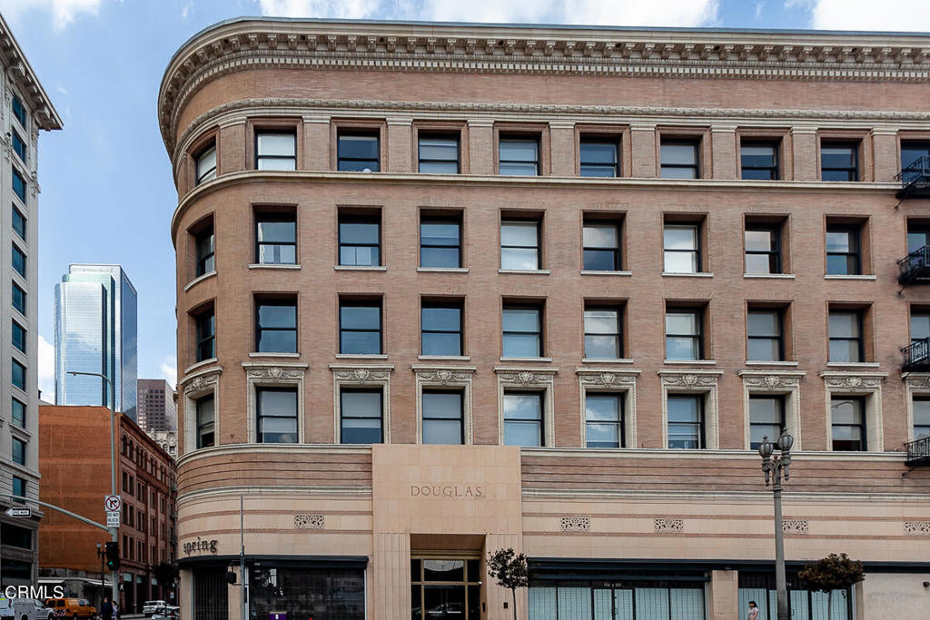 257 South Spring Street, Unit PHE Los Angeles, CA 90012 - Photo 28 of 29 a front view of a building with a lot of windows