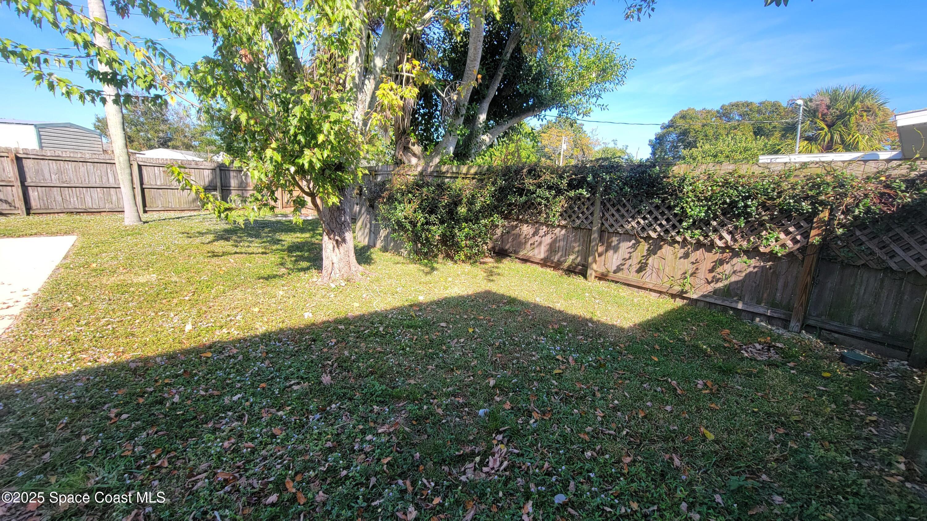 2162 Post Road Melbourne, FL 32935 - Photo 32 of 37 a view of a yard with swimming pool