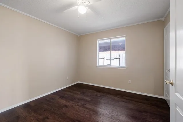 a kitchen with granite countertop a stove sink and cabinets