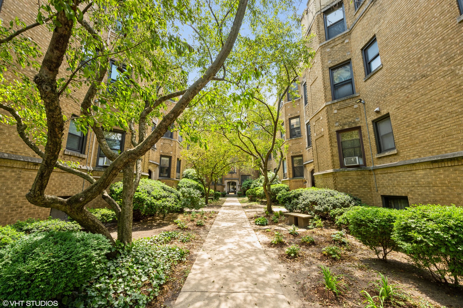 545 West Brompton Avenue, Unit 2N Chicago, IL 60657 - Photo 1 of 10 a pathway of a house with a yard