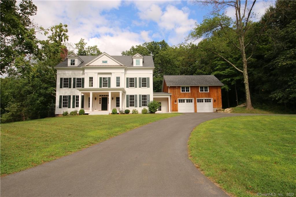 225 Bennetts Farm Road Ridgefield, CT 06877 - Photo 1 of 1 a front view of a house with a garden