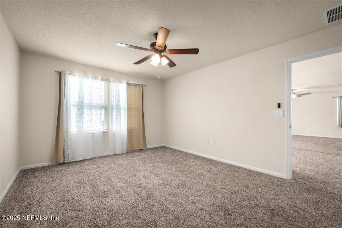 2080 Denton Trace Green Cove Springs, FL 32043 - Photo 24 of 32 a view of an empty room with a window