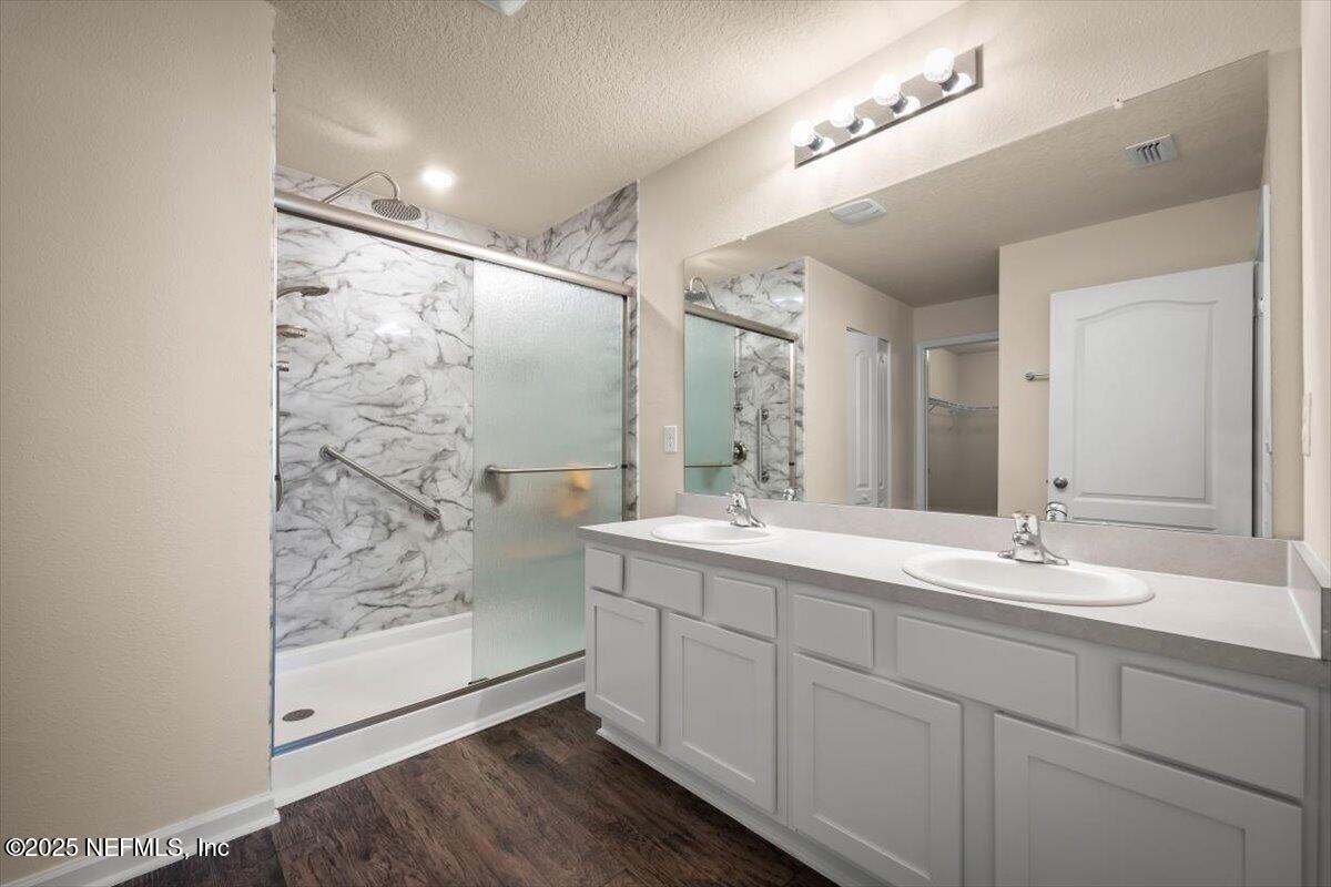 2080 Denton Trace Green Cove Springs, FL 32043 - Photo 26 of 32 a bathroom with a double vanity sink mirror and shower
