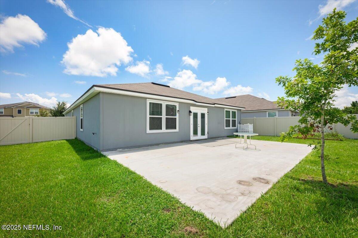 2080 Denton Trace Green Cove Springs, FL 32043 - Photo 30 of 32 a backyard of a house with table and chairs