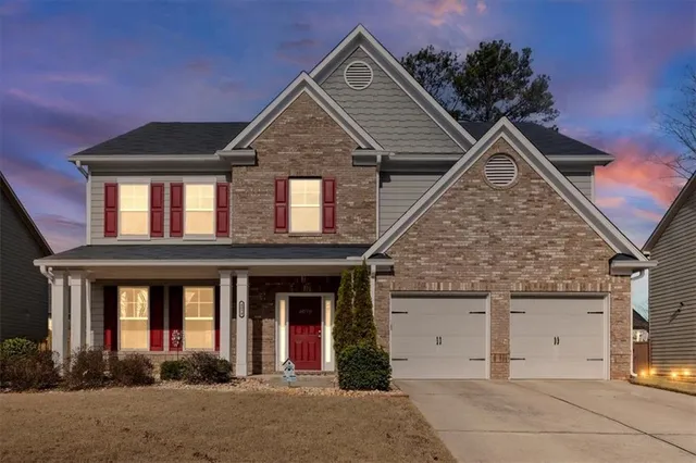 front view of a house with a yard