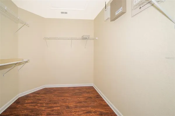 a view of a room with wooden floor