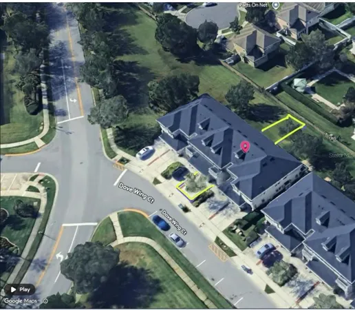 an aerial view of a house with outdoor space