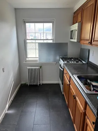 a kitchen that has a sink and a stove