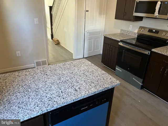 a kitchen with a sink and cabinets