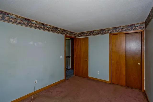 a view of a room with wooden walls