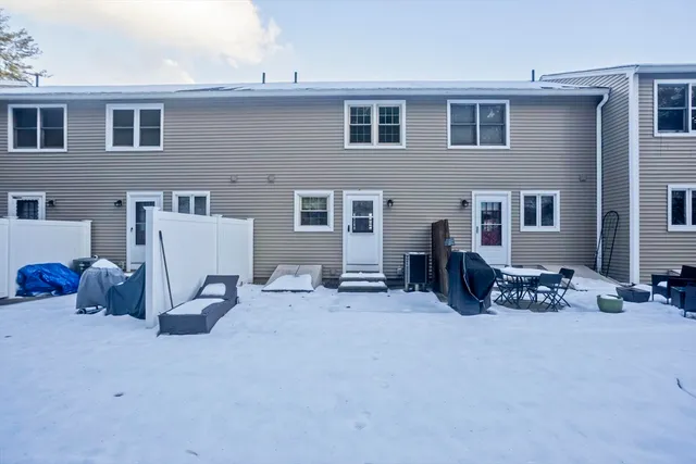 a group of chairs sitting in front of a house