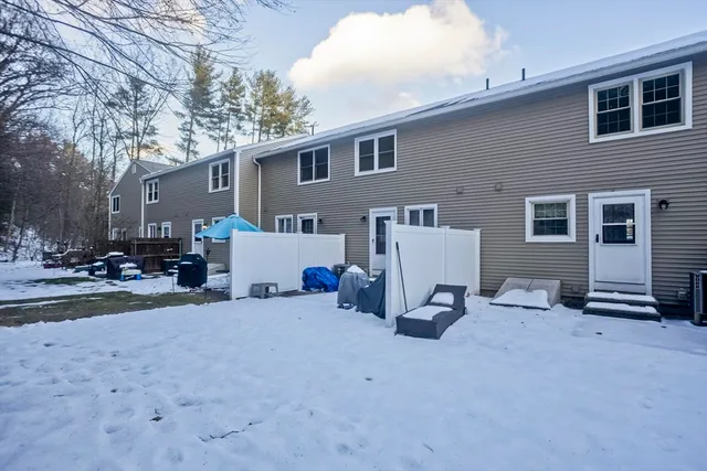 a view of a house with a yard and garage