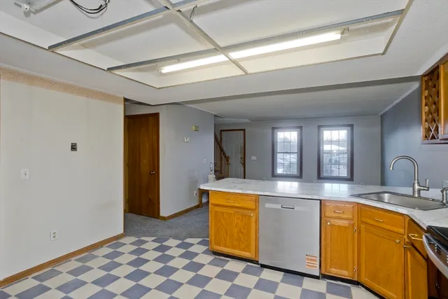 a large bathroom with a sink a mirror and bathtub