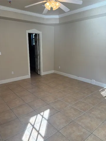 a view of an empty room and window