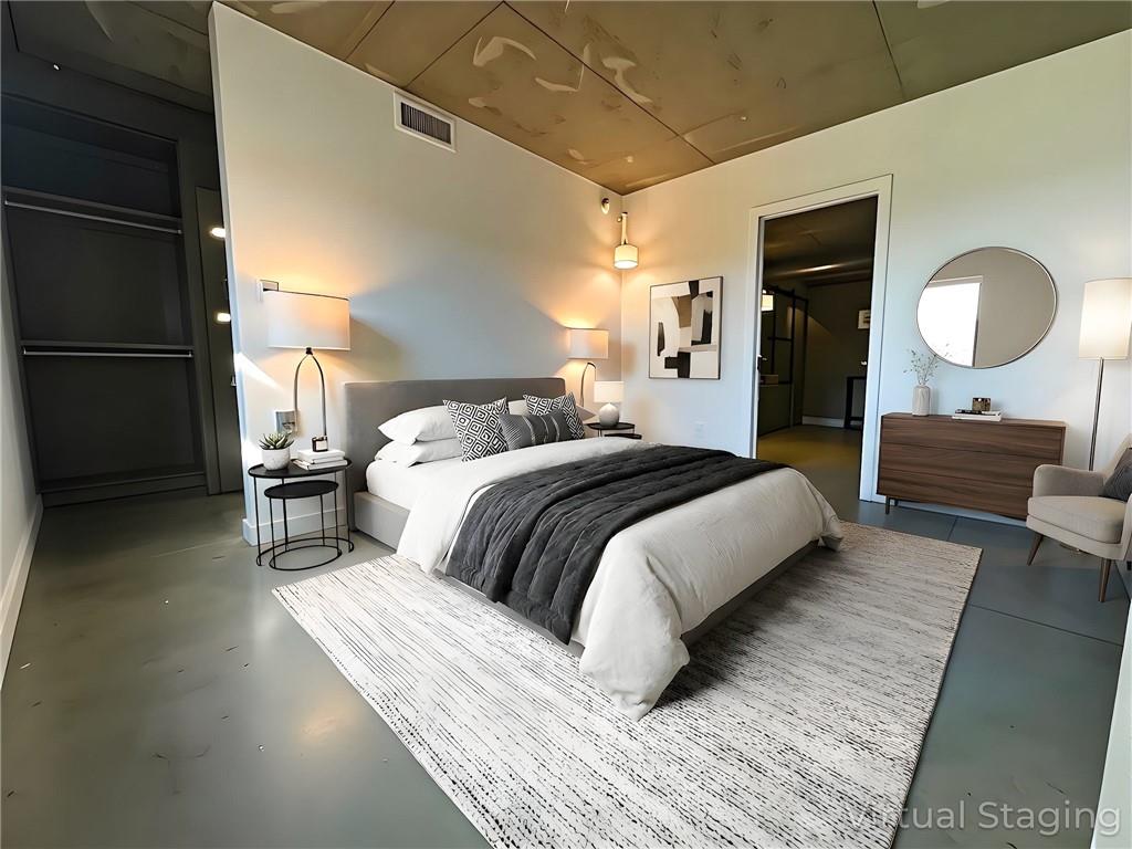 850 Ralph McGill Boulevard Northeast, Unit 30 Atlanta, GA 30306 - Photo 9 of 21 a bedroom with a bed and a lamp