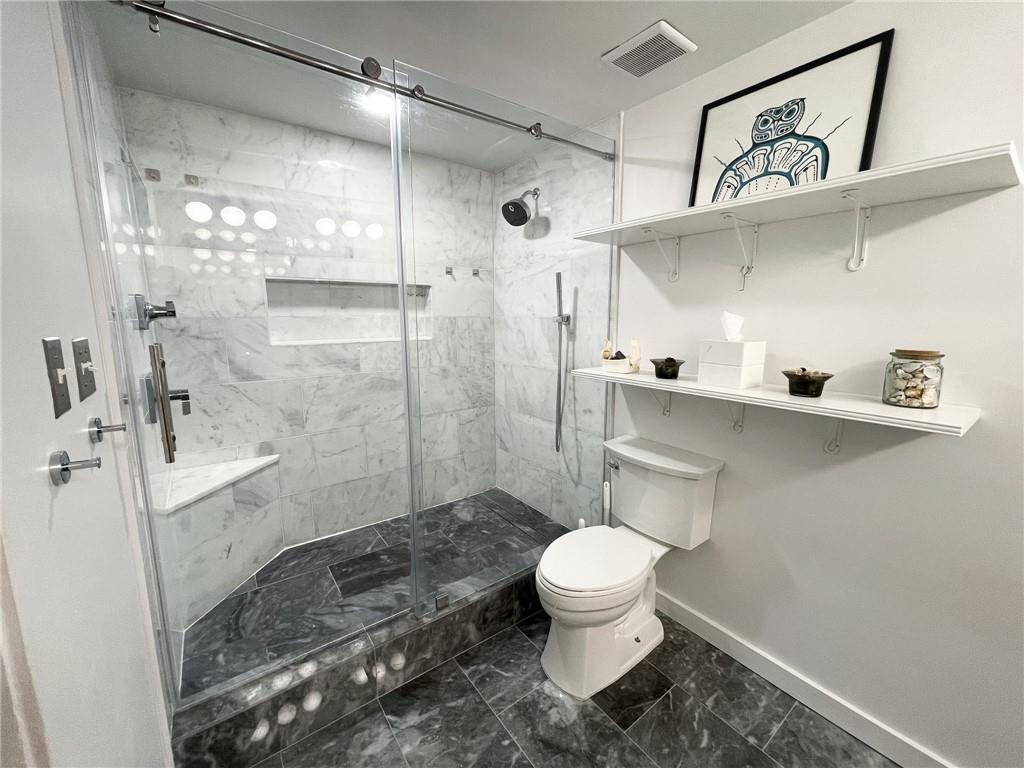 850 Ralph McGill Boulevard Northeast, Unit 30 Atlanta, GA 30306 - Photo 10 of 21 a bathroom with a sink a toilet and shower