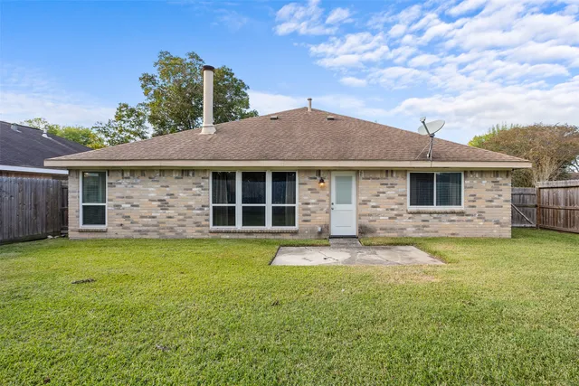 a front view of a house with a garden and porch