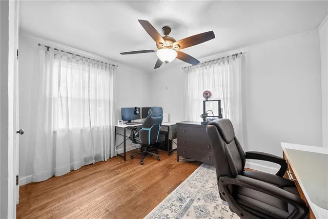 a work room with furniture and a window