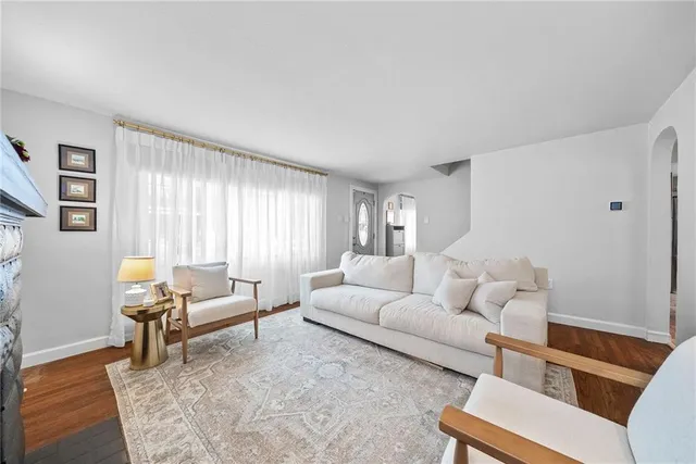 a living room with furniture and a rug