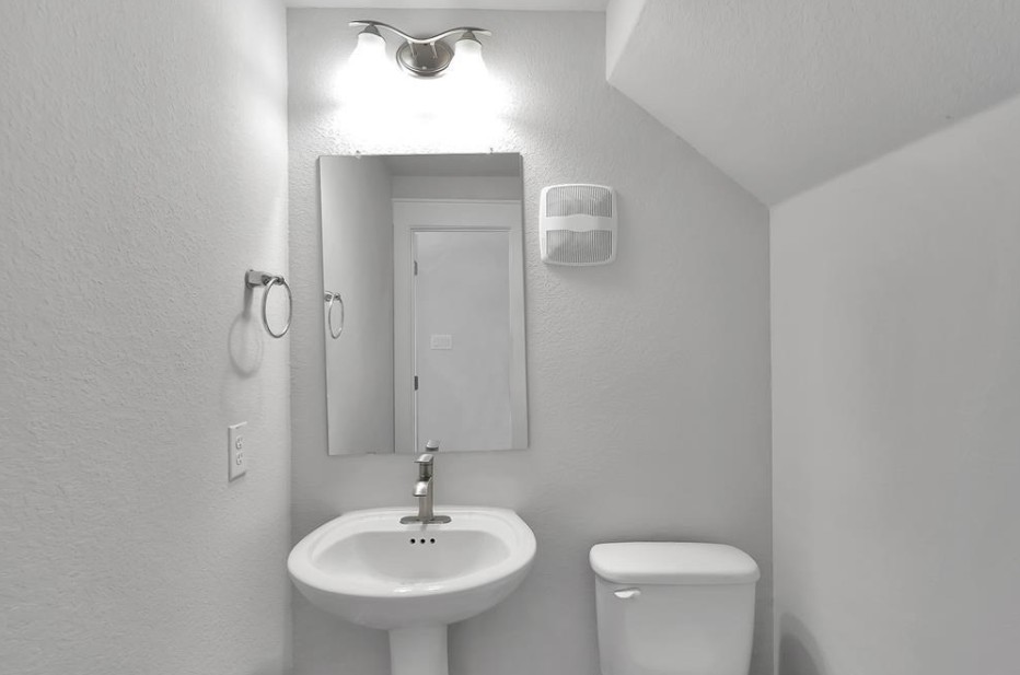 300 Old Trinity Way Georgetown, TX 78628 - Photo 12 of 16 Half bath with toilet and a textured wall