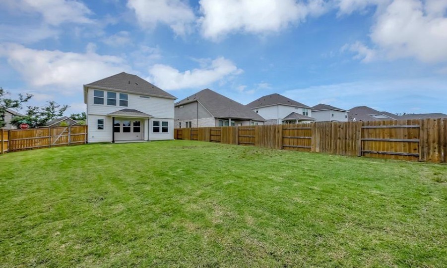 300 Old Trinity Way Georgetown, TX 78628 - Photo 13 of 16 Fenced backyard with a residential view