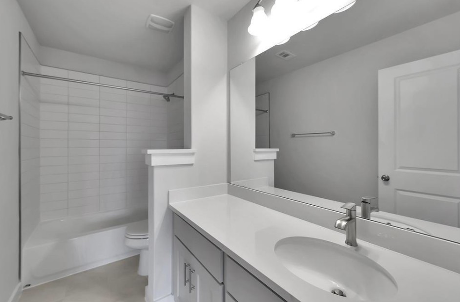 300 Old Trinity Way Georgetown, TX 78628 - Photo 5 of 16 Bathroom with vanity and shower / bathtub combination