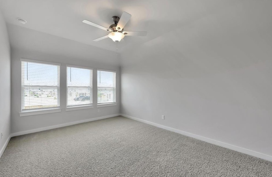 300 Old Trinity Way Georgetown, TX 78628 - Photo 7 of 16 Spare room with ceiling fan, carpet, and vaulted ceiling