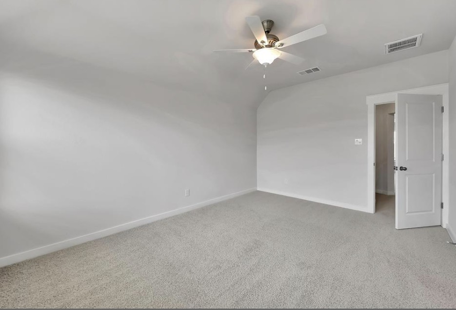 300 Old Trinity Way Georgetown, TX 78628 - Photo 8 of 16 Spare room with carpet floors, ceiling fan, and lofted ceiling