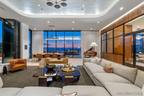 a view of a patio with a table and chairs and potted plants