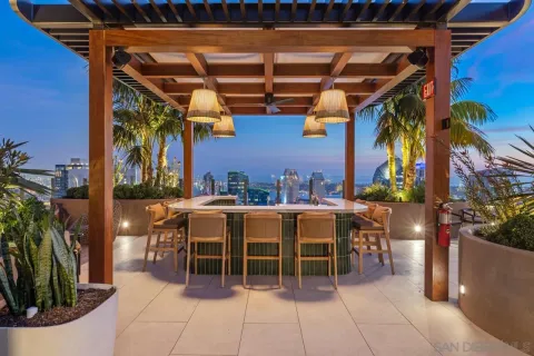 a lobby with furniture and potted plant