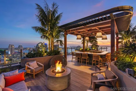 a lobby with furniture and potted plant